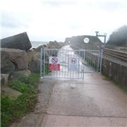 New signage and entrance barriers on sea wall